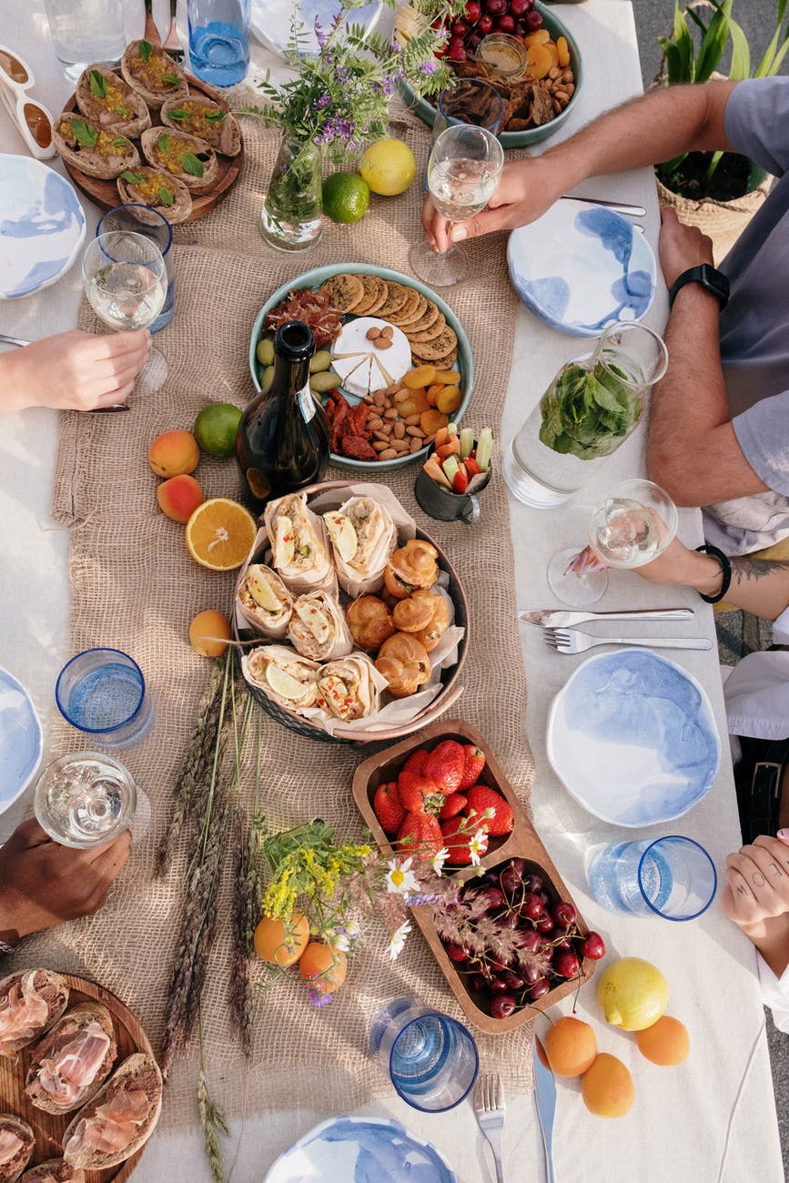 Plan a  potluck to save money during the holidays